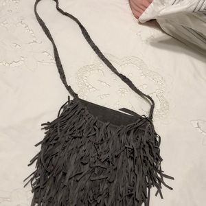 Gray tassel over the shoulder purse